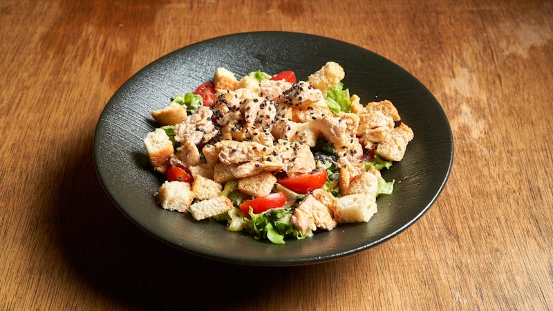 Grilled Chicken Salad bowl with mixed greens and toppings